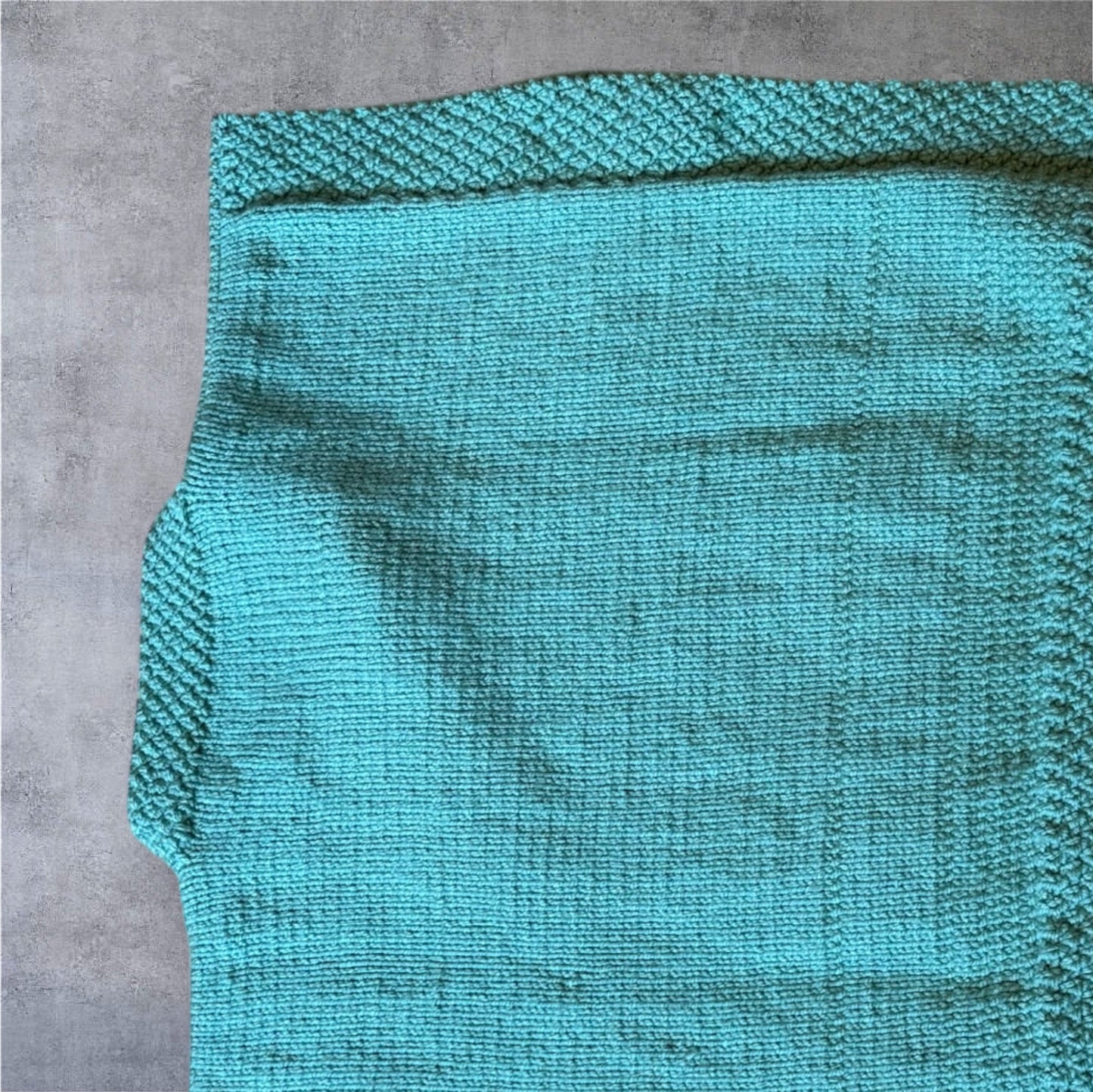 Luxury Hand-Knit Children’s Poncho (Aqua)
Made in Donegal