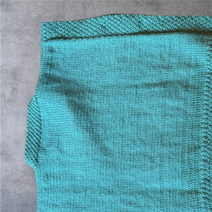 Luxury Hand-Knit Children’s Poncho (Aqua)
Made in Donegal