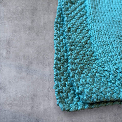 Luxury Hand-Knit Children’s Poncho (Aqua)
Made in Donegal