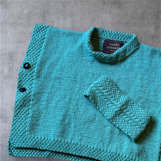 Luxury Hand-Knit Children’s Poncho (Aqua)
Made in Donegal