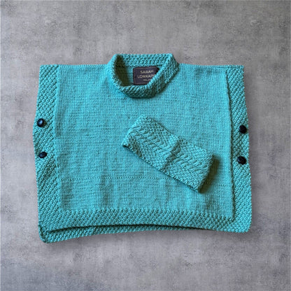 Luxury Hand-Knit Children’s Poncho (Aqua)
Made in Donegal